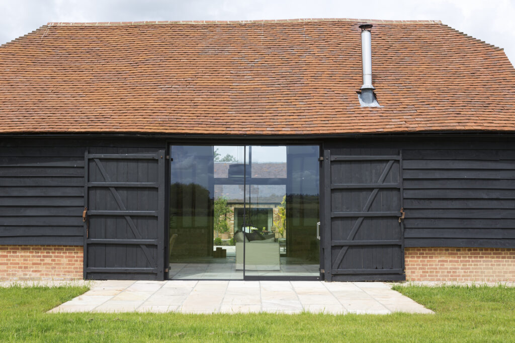 Oxford,UK,Glass sliding doors of converted barn home