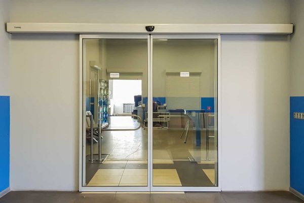Empty sliding glass front door at the airport. Glass doors in the office. Glass entrance. Entrance